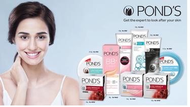 A smiling woman with the Pond's product range 