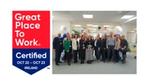Great Place to World Certified Ireland, group of people in office smiling at camera 