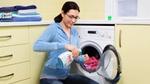 A woman using Persil with her washing