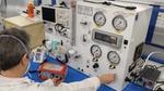 Image shows a scientist testing a ventilator at Smiths Medical