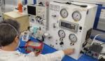 Image shows a scientist testing a ventilator at Smiths Medical