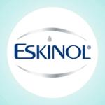 Eskinol is written in blue, with a drop in place of the dot on letter i. A silver oval surrounds the word.