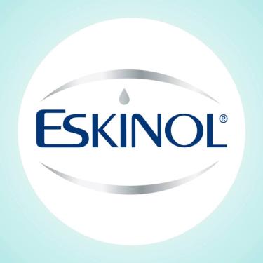 Eskinol is written in blue, with a drop in place of the dot on letter i. A silver oval surrounds the word.