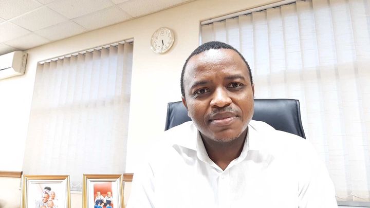 A profile shot of Unilever hero Zenzele Sangweni sitting in his office in South Africa