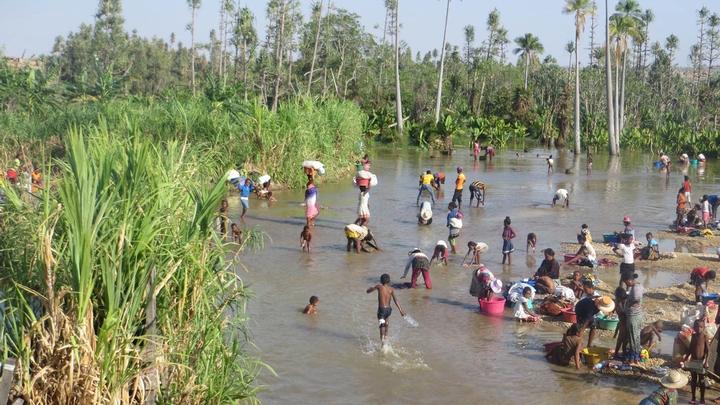Villagers in Magadgascar using river for drinking water and domestic use