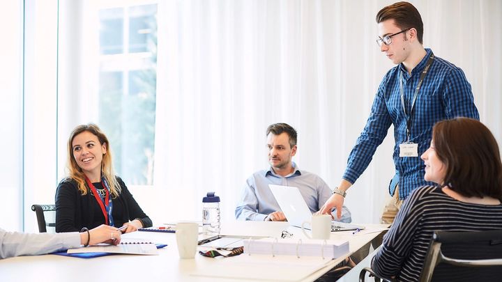 A group of people having a meeting