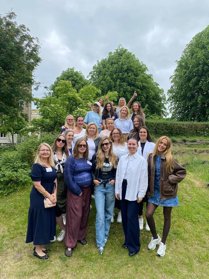Group portrait of WECODA members in the garden