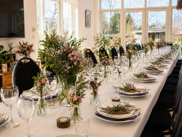 Decorated table with flowers and place settings