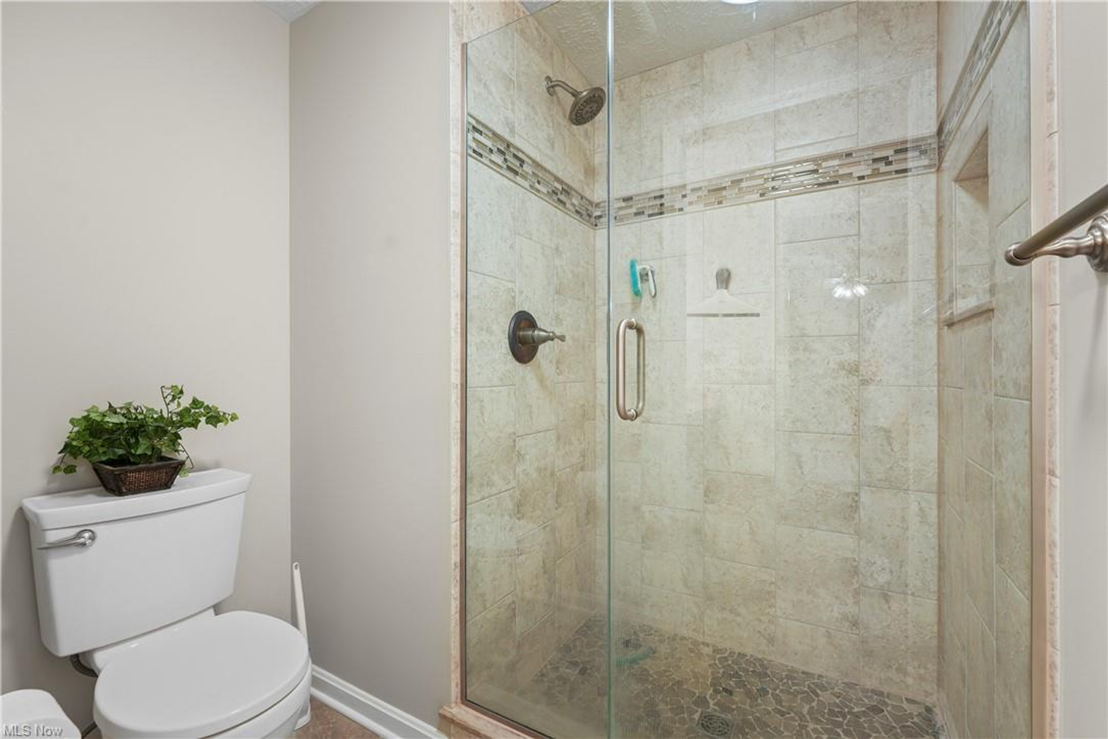 Full bathroom with tiled walk-in shower