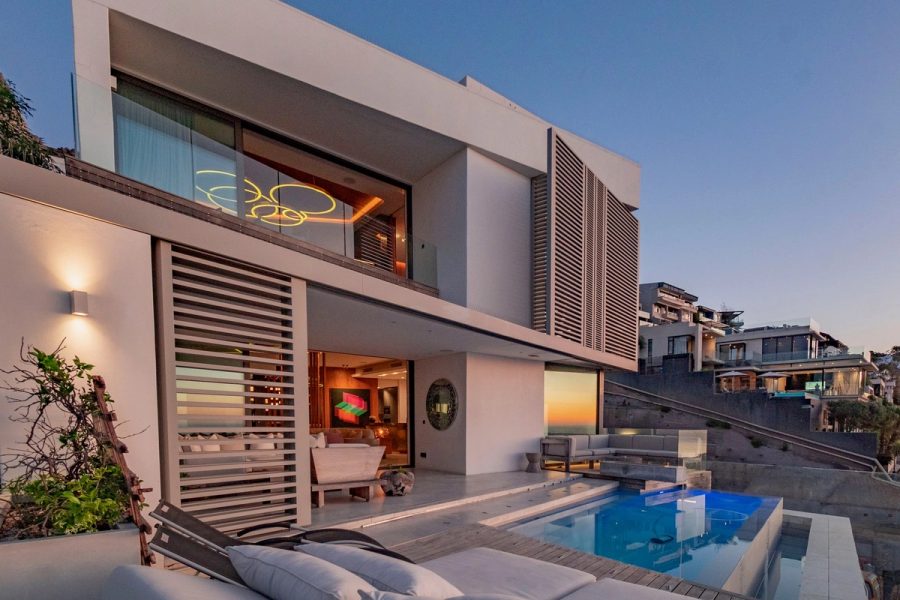 Art Villa infinity pool and sculptural exterior at sunset in Bantry Bay