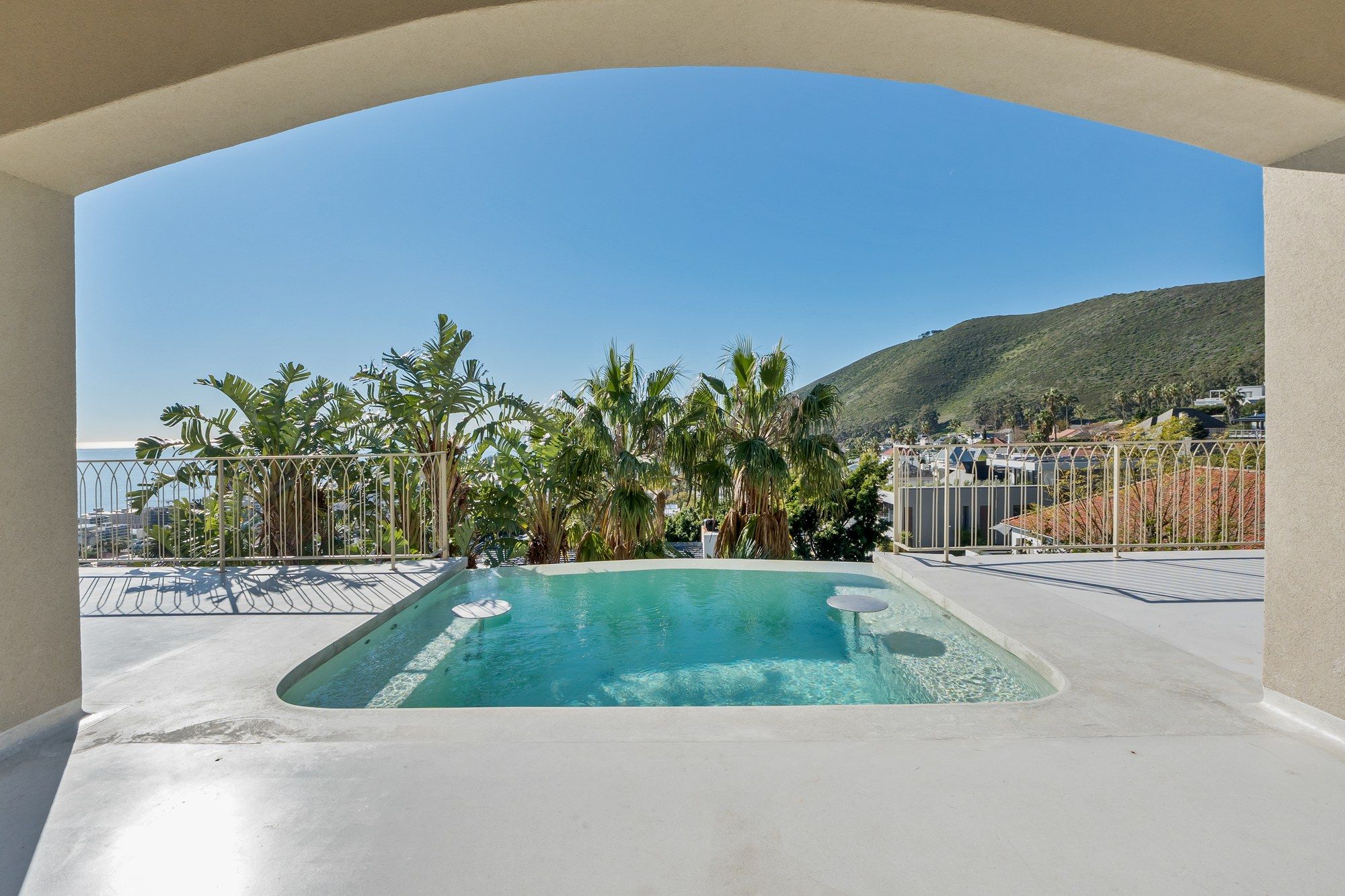 Plunge pool with mountain and ocean views