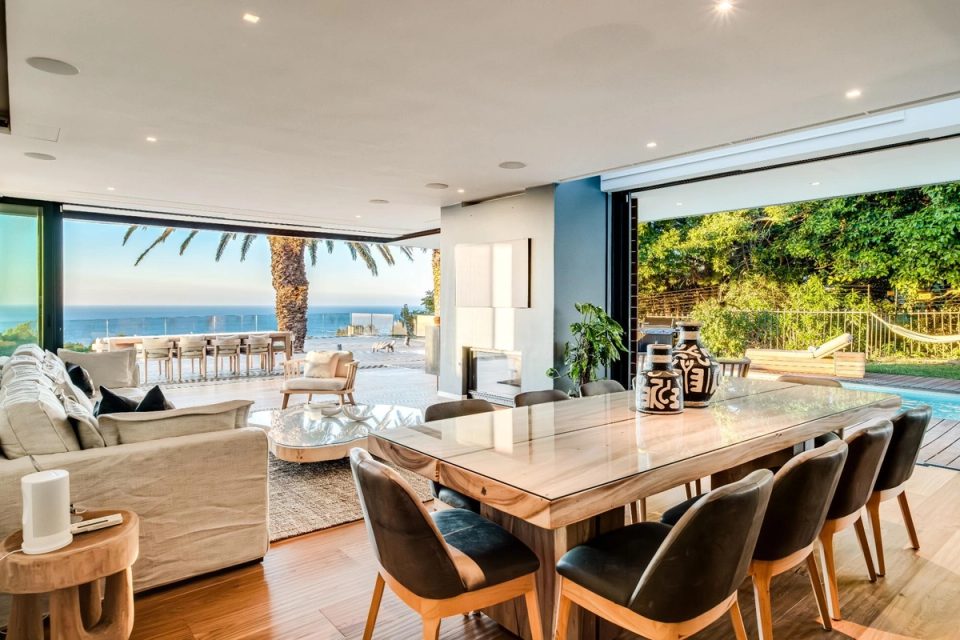 Dining area opening to the pool at Lion's Lookout