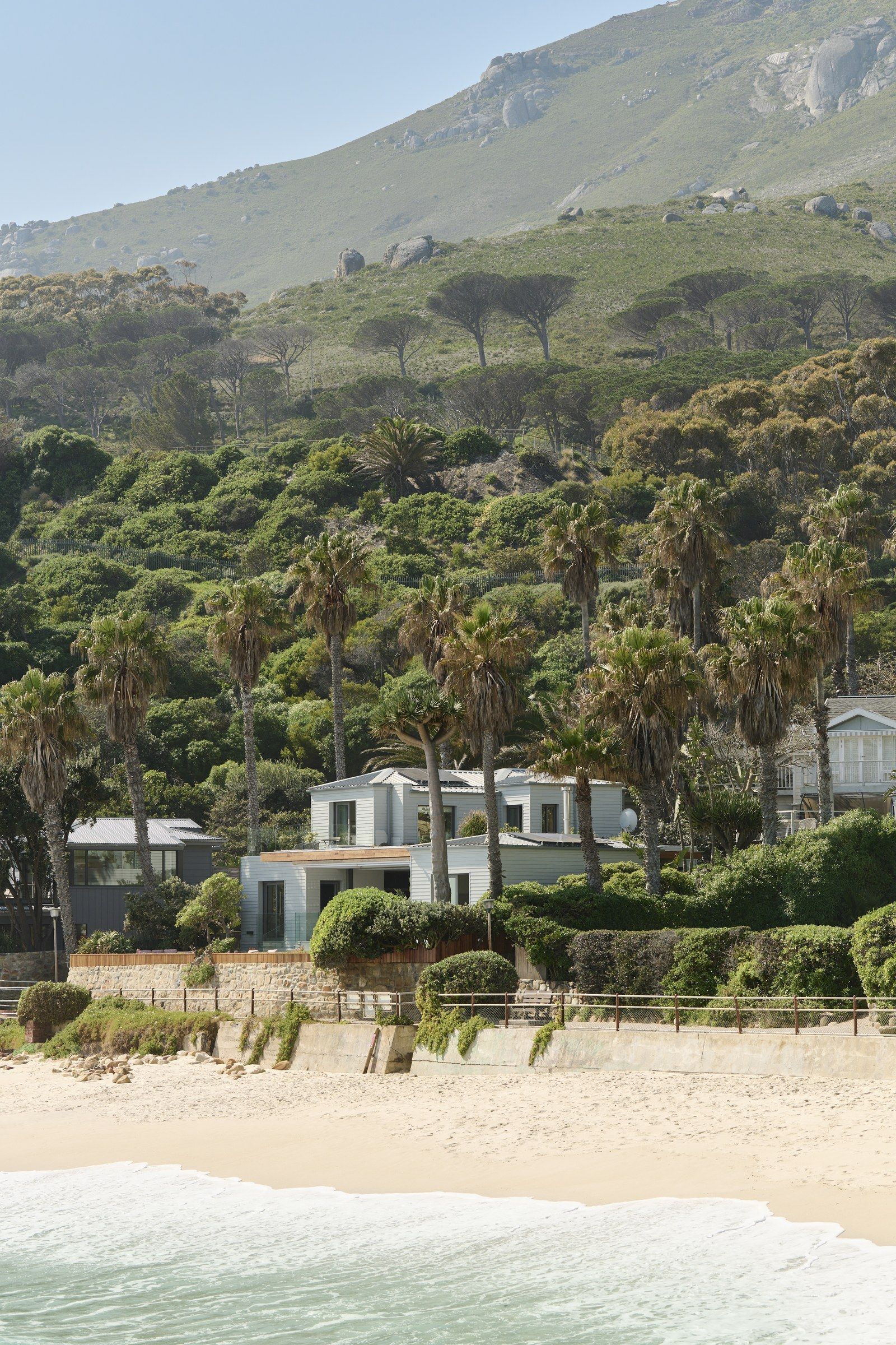 Ivory Kai exterior on Glen Beach with Lion's Head and the Twelve Apostles behind