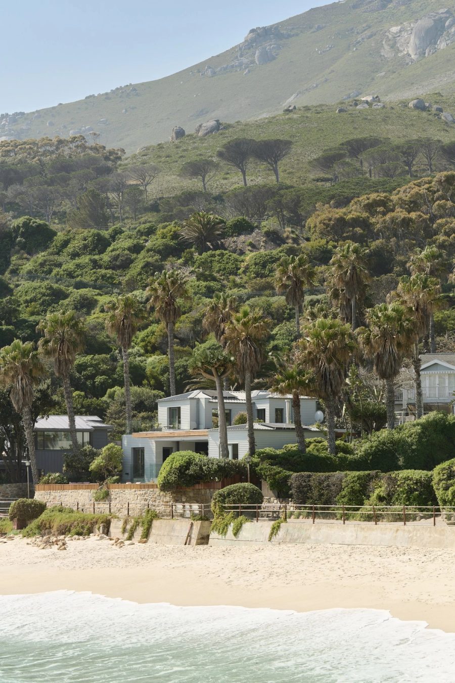 Ivory Kai exterior on Glen Beach with Lion's Head and the Twelve Apostles behind
