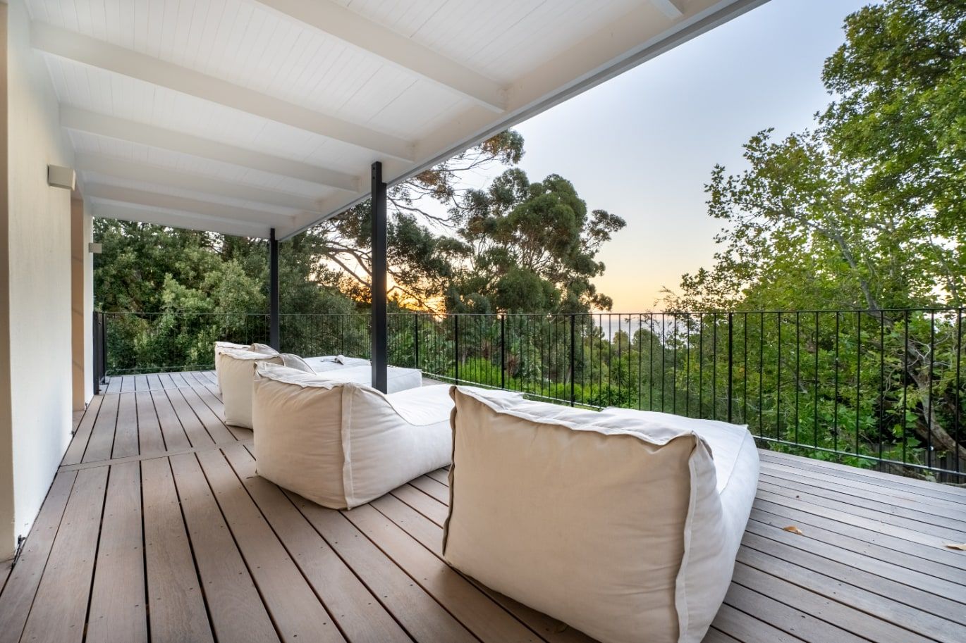 Covered upper terrace overlooking the leafy Camps Bay setting