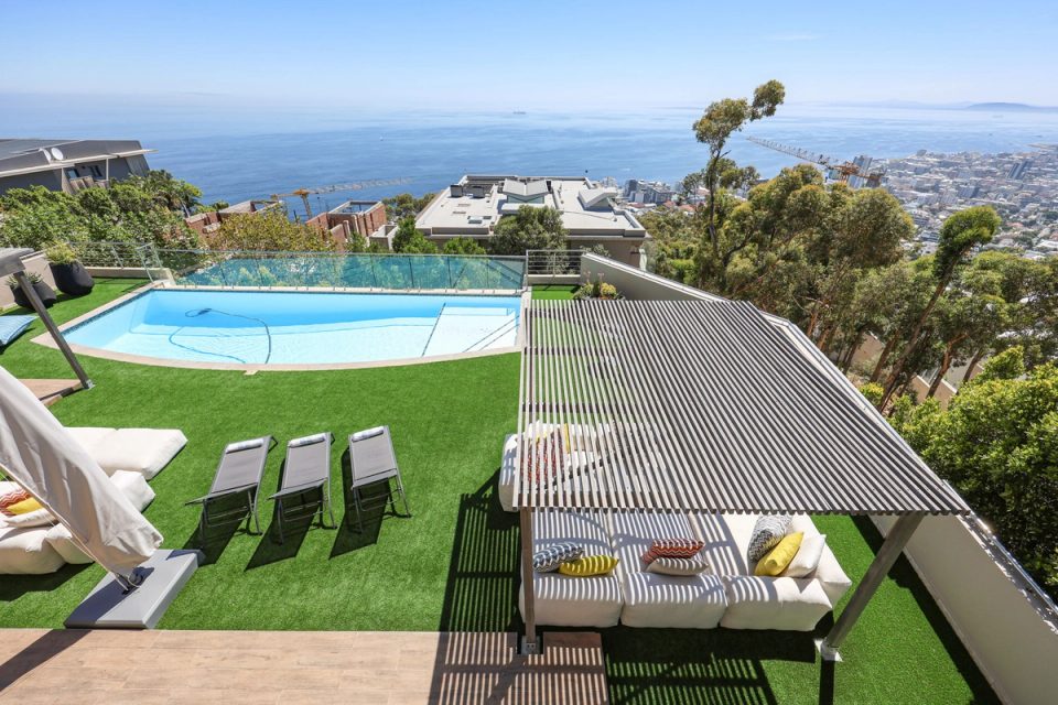 Pool terrace with shaded outdoor lounges