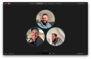 Team members sharing a laugh in an around video call