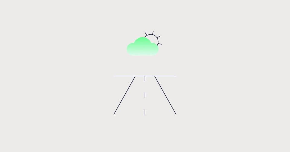 A road towards a sky with the sun coming out
