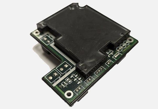 Injection-moulded dam on PCB