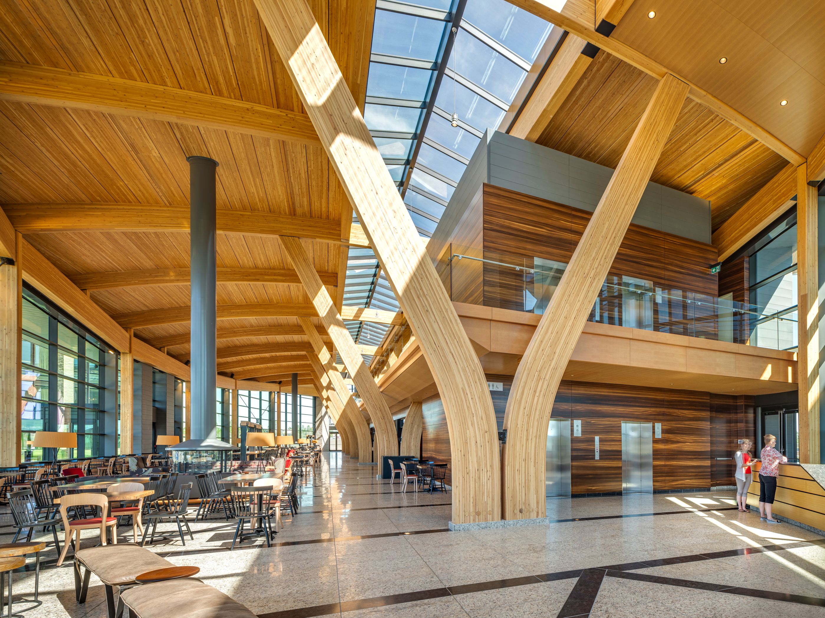 a large building with a lot of windows and wooden beams .
