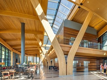 a large building with a lot of windows and wooden beams .