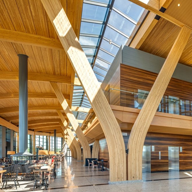 a large building with a lot of windows and wooden beams .