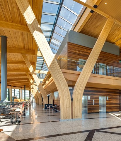 a large building with a lot of windows and wooden beams .