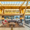 it is a large room with a lot of furniture and tables .