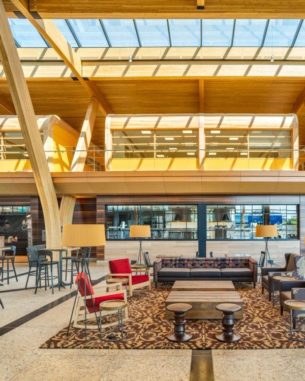 it is a large room with a lot of furniture and tables .