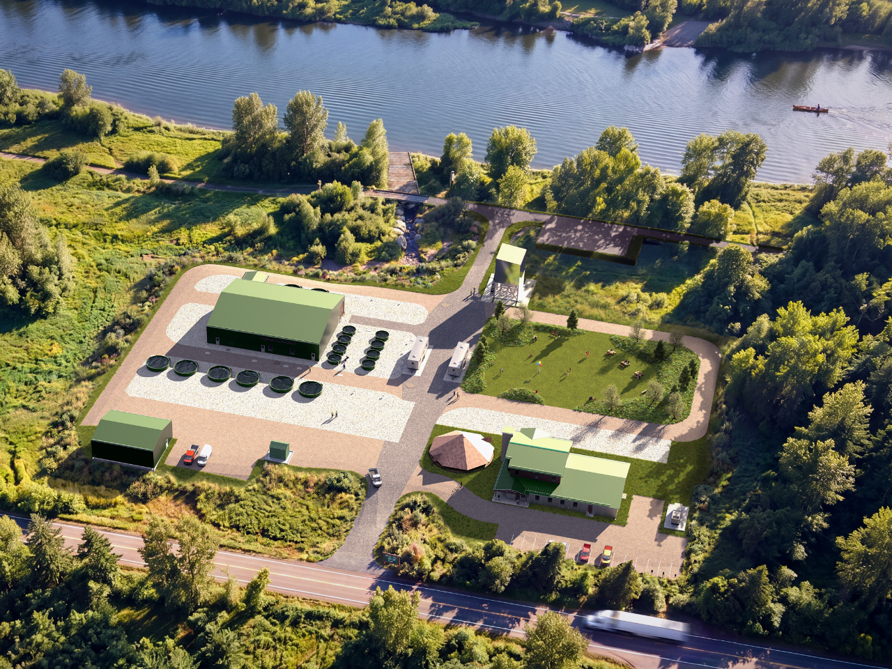 Aerial view of a modern facility with green buildings and circular tanks next to a river, surrounded by trees.