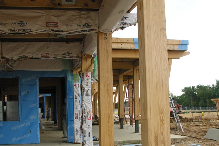 a building under construction with anthony power products covering the ceiling