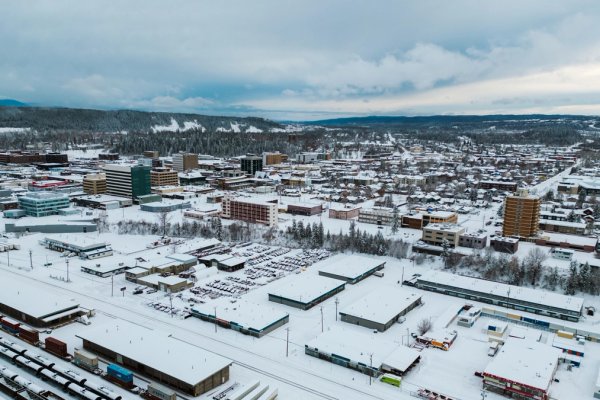an aerial view of the city of Prince George covered in snow .