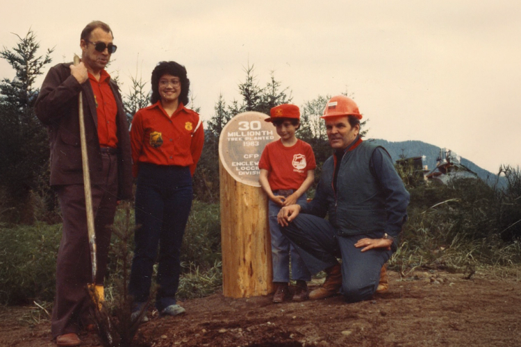 a group of people standing in front of a sign that says 30 million