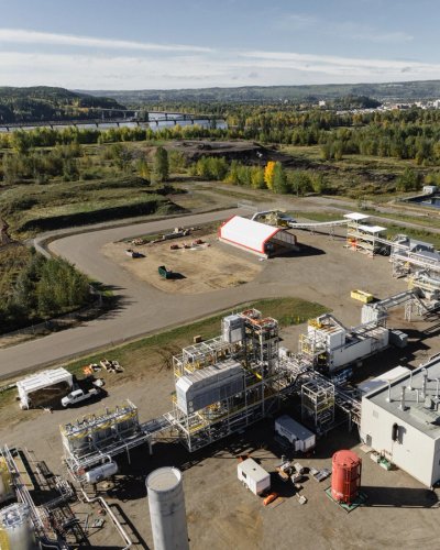 an aerial view of a large industrial area with a lot of buildings and machinery .