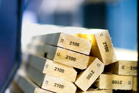 a stack of wooden boards with the number 2100 on them