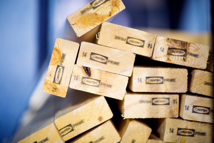 a pile of wooden blocks stacked on top of each other .