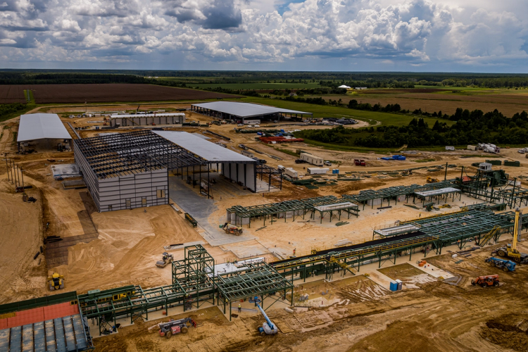 an aerial view of a construction site with a large building in the middle