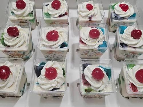 Marbled decorative jello cups with whipped cream and cherry