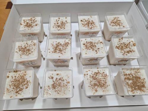 Arroz con leche cups topped with cinnamon