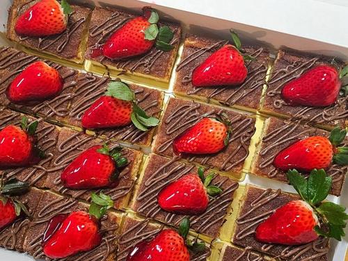 Choco flan bars topped with strawberries