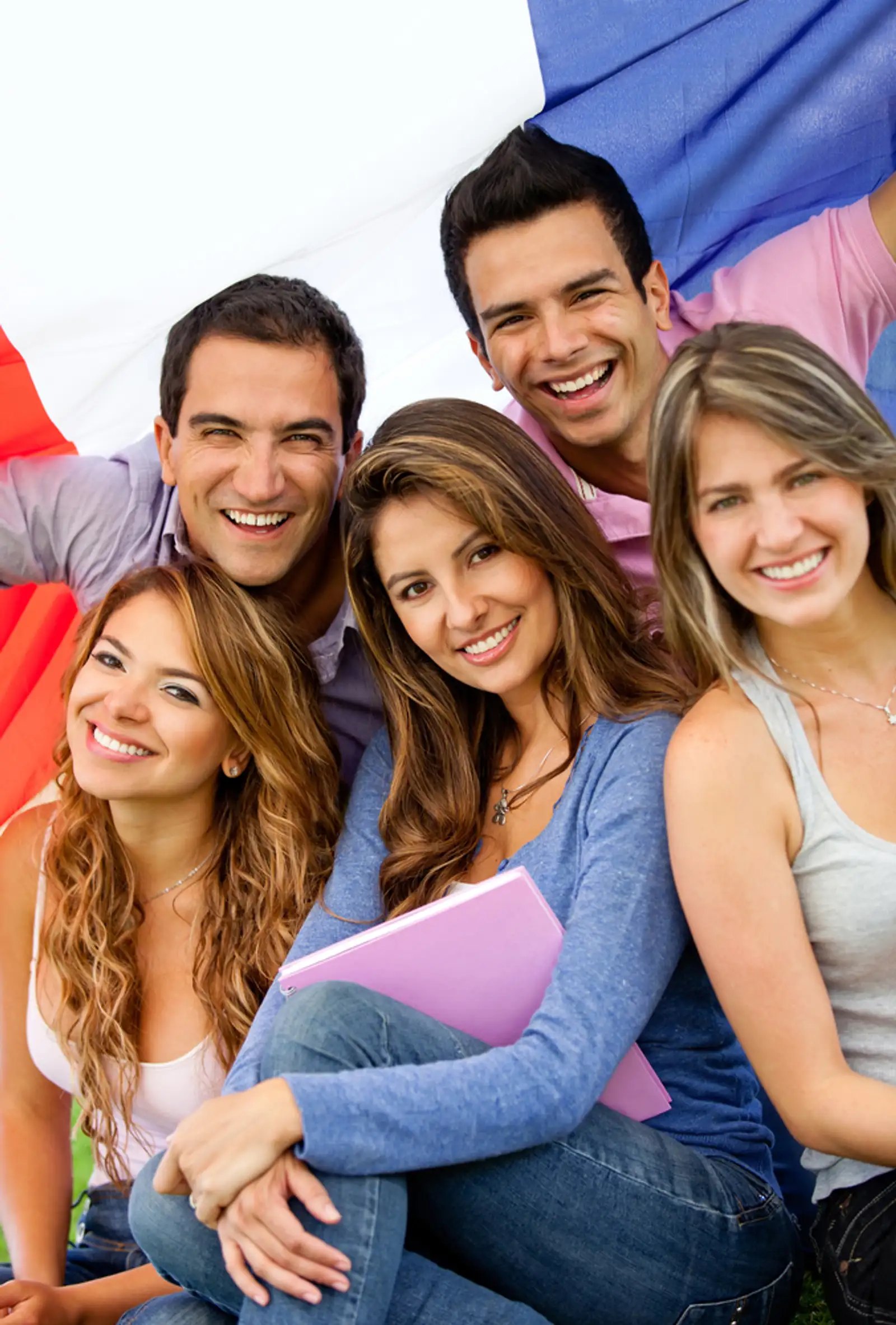 Happy group of French students with the flag of France.jpeg