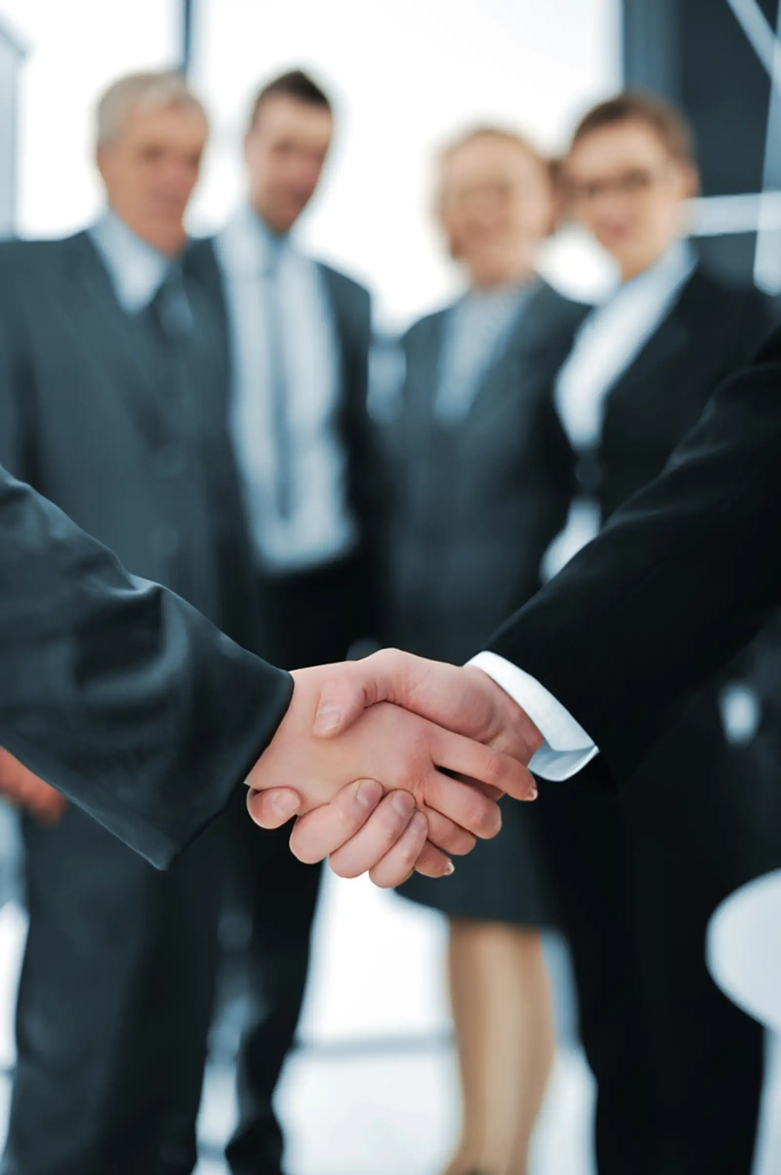 Handshake isolated on business background.jpeg