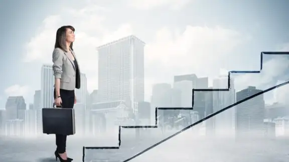 Business person in front of a staircase%2c city on the background.jpeg