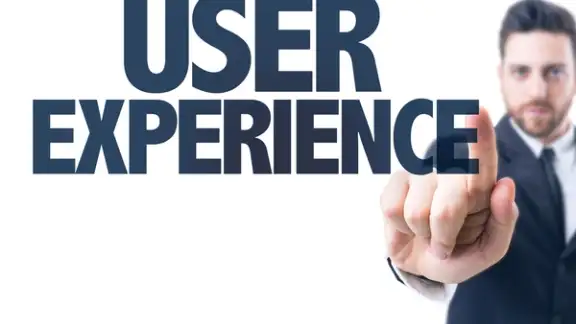 Business man pointing the text User Experience.jpeg