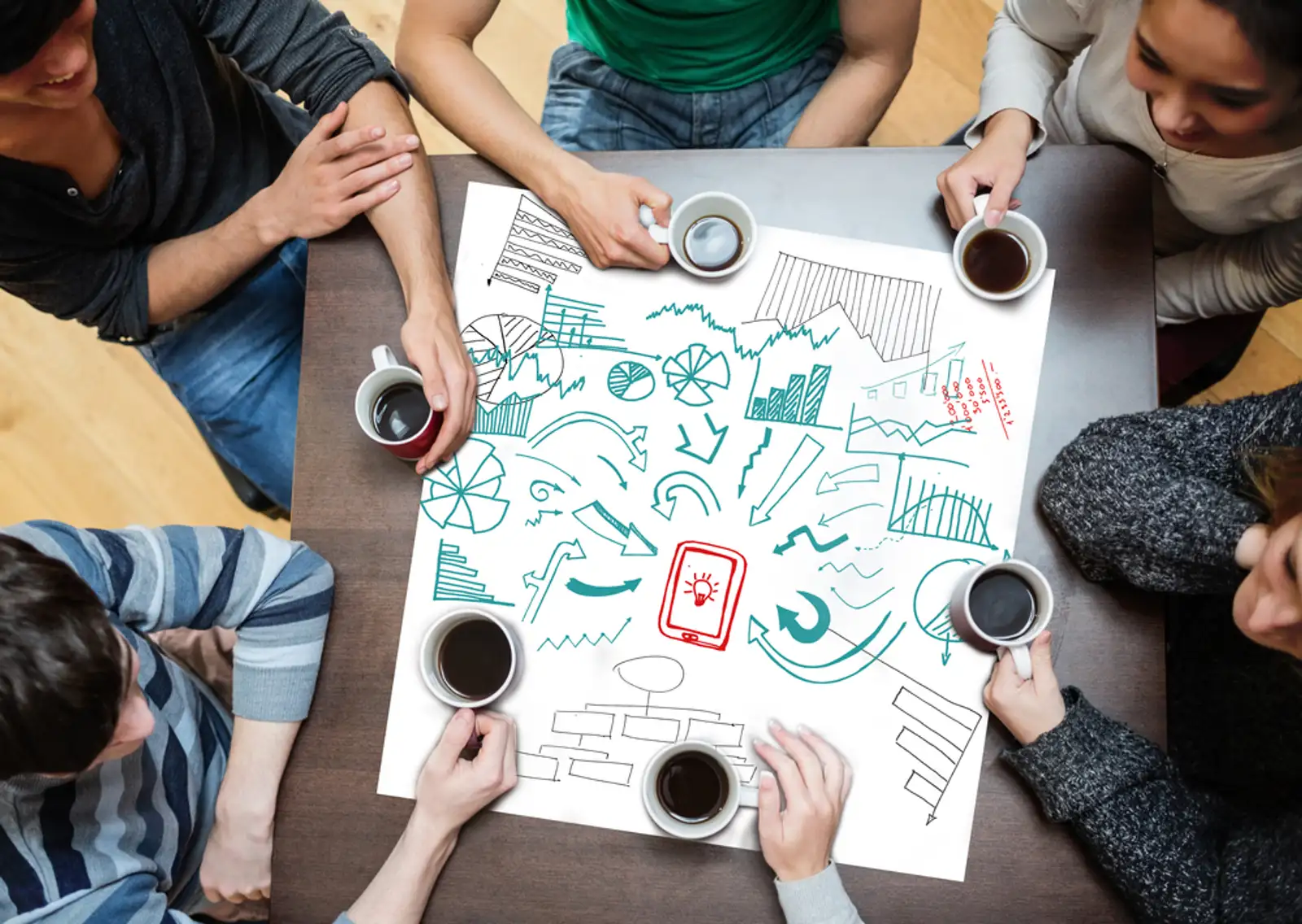 Drawings of charts and arrows drew on a poster during a brainstorm.jpeg