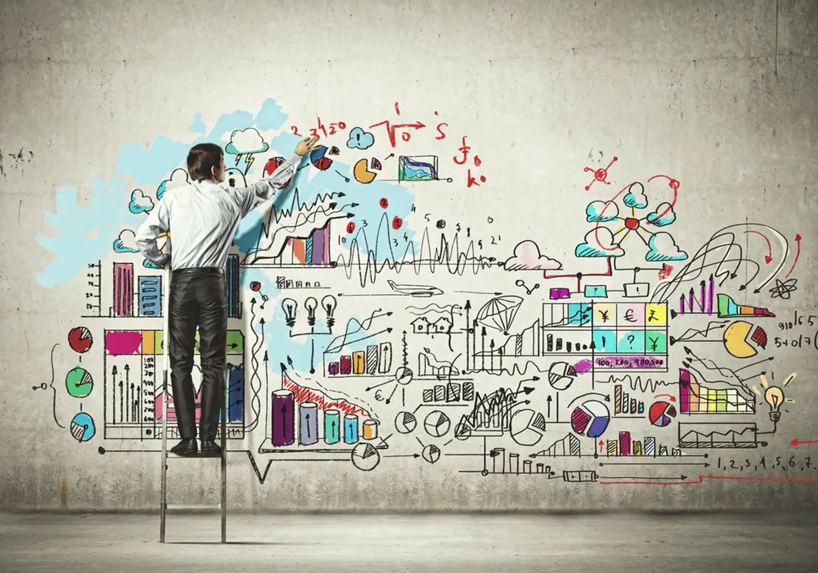 Back view of businessman drawing sketch on wall.jpeg