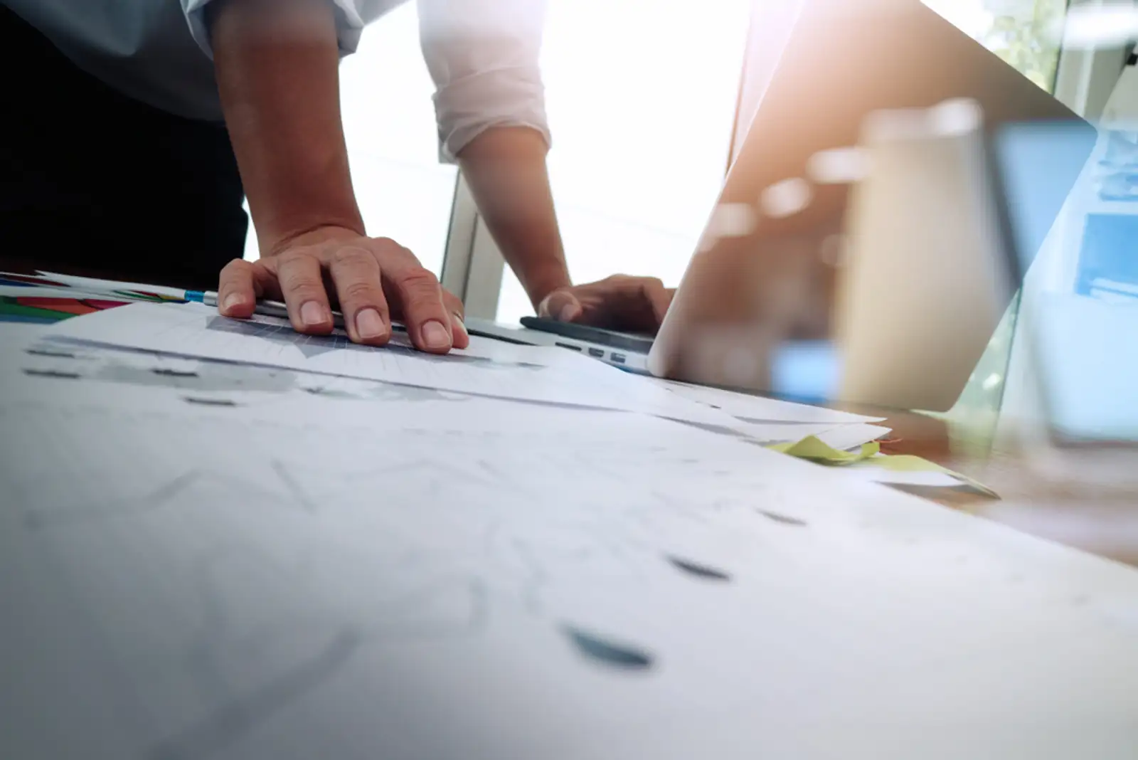 Double exposure of businessman hand working with new modern computer and business strategy as concept.jpeg