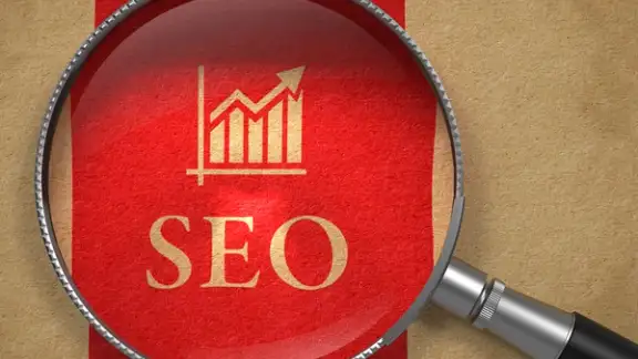 SEO - Internet Concept Magnifying Glass with SEO and Growth Chart Icon on Old Paper with Red Vertical Line Background.-1.jpeg
