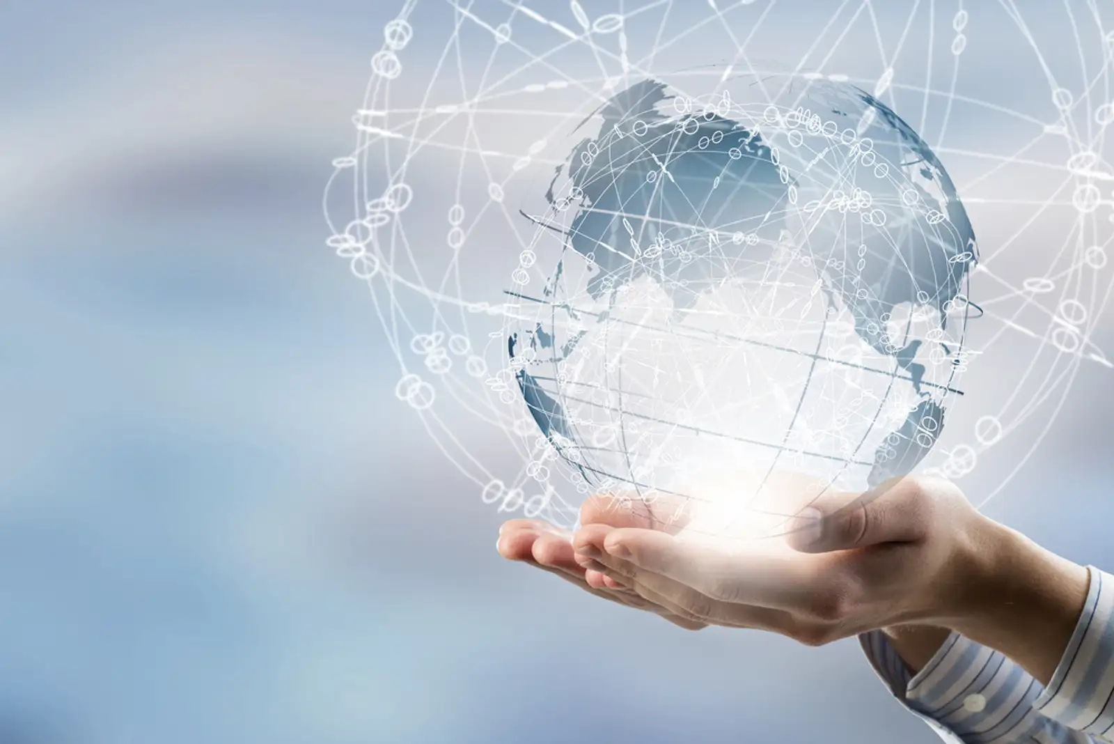 Global connection concept with digital planet in hands.jpeg