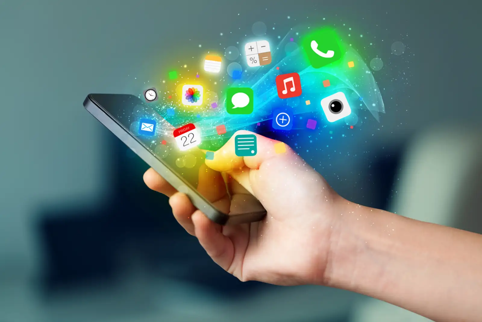 Hand holding smartphone with colorful app icons concept-1.jpeg